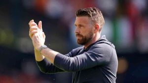 Former Luton Town manager Rob Edwards applauds the fans ahead of the Premier League match at Kenilworth Road, Luton, Sunday May 19, 2024. (Joe Giddens/PA via AP)