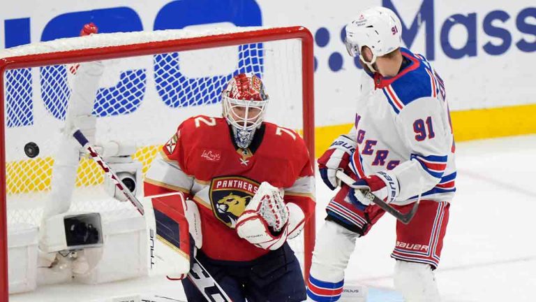 New York Rangers centre Alex Wennberg (91) deflects the puck into the net against Florida Panthers goaltender Sergei Bobrovsky (72) in an overtime period of Game 3 during the Eastern Conference finals of the NHL hockey Stanley Cup playoffs, Sunday, May 26, 2024, in Sunrise, Fla. The Rangers beat the Panthers 5-4 in overtime. (Wilfredo Lee/AP)