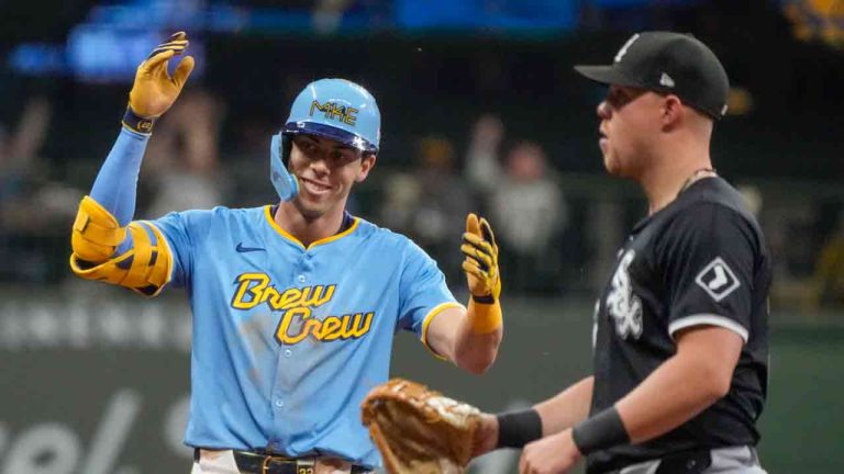 Milwaukee Brewers' Christian Yelich reacts in front of Chicago White Sox's Gavin Sheets after hitting a two-run scoring double during the seventh inning of a baseball game Friday, May 31, 2024, in Milwaukee. The double was Yelich's 300th career double. (Morry Gash/AP)