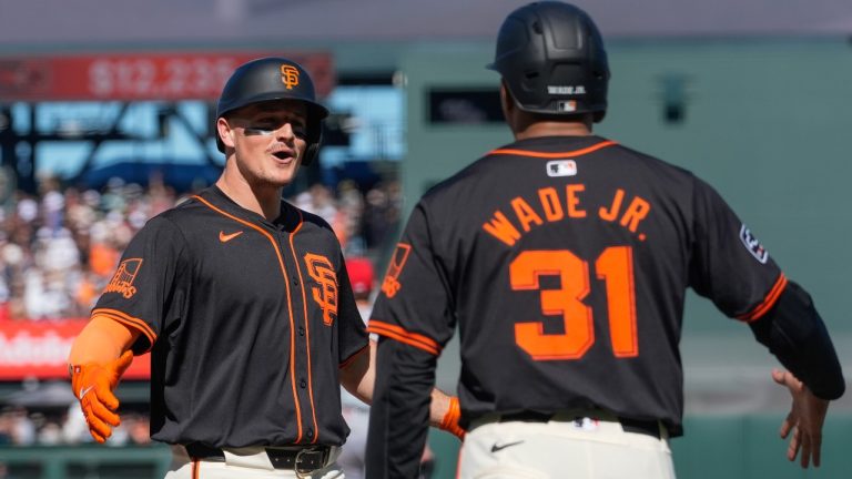 San Francisco Giants' Matt Chapman, left, celebrates with LaMonte Wade Jr. after hitting a grand slam against the Cincinnati Reds during the first inning of a baseball game Saturday, May 11, 2024, in San Francisco. (Godofredo A. Vásquez/AP)