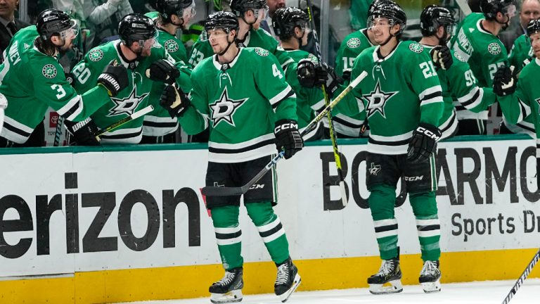 Dallas Stars defenceman Miro Heiskanen (4) skates with teammate Jason Robertson (21) near their bench after Heiskanen scored a second period power play goal in Game 5 of an NHL hockey Stanley Cup second-round playoff series against the Colorado Avalanche, Wednesday, May 15, 2024, in Dallas. (Tony Gutierrez/AP)