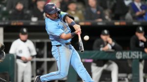 Toronto Blue Jays' Davis Schneider hits an RBI sacrifice fly off Chicago White Sox relief pitcher Tanner Banks during the sixth inning of a baseball game Tuesday, May 28, 2024, in Chicago. (Charles Rex Arbogast/AP Photo)