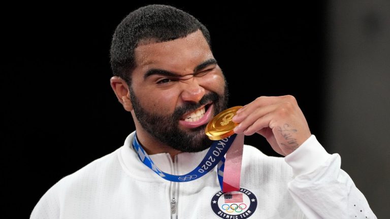 FILE - In this Aug. 6, 2021, file photo, United State's Gable Dan Steveson poses with his gold medal during the medal ceremony for the men's freestyle 125kg wrestling at the 2020 Summer Olympics. (AP Photo/Aaron Favila, File)