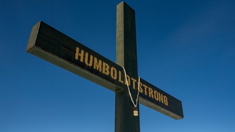 Police and community leaders in western Manitoba are looking to Saskatchewan for advice following a fatal collision that has drawn comparisons to the deadly Humboldt Broncos bus crash. A memorial on the roadside where the Humboldt Broncos bus crash took place is shown on Highway 35 near Armley, Sask., Saturday, March 18, 2023. THE CANADIAN PRESS/Liam Richards