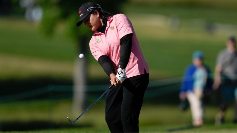 Wichanee Meechai, of Thailand, chips to the 18th green during the second round of the U.S. Women's Open golf tournament. (AP Photo/Matt Rourke)