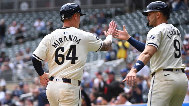 Minnesota Twins' Jose Miranda (64) celebrates with Trevor Larnach (9) after scoring on a Manuel Margot double against the Seattle Mariners during the first inning of a baseball game, Thursday, May 9, 2024, in Minneapolis. Trevor Larnach and Max Kepler also scored. (Craig Lassig/AP)