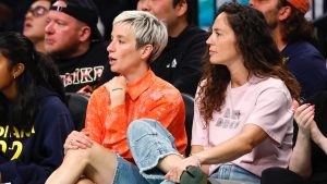 Megan Rapinoe, left, and Sue Bird, right, sit courtside during the second half of the WNBA basketball game between the Indiana Fever and the New York Liberty, Saturday, May 18, 2024, in New York. (Noah K. Murray/AP)