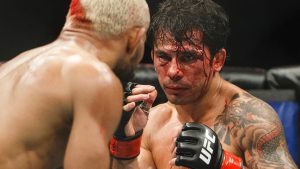 Alexandre Pantoja seen bleeding as he fights Deiveson Figueiredo at UFC 240 in Edmonton in 2019. (Jason Franson/CP)