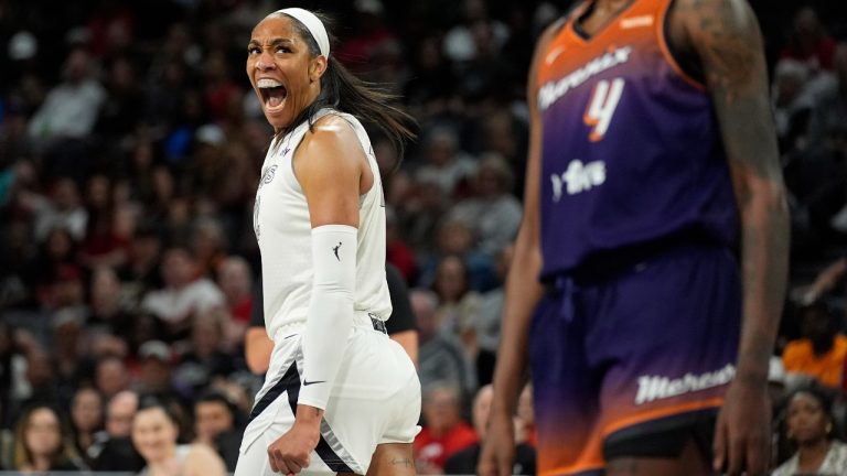 Las Vegas Aces center A'ja Wilson (22) celebrates after scoring against the Phoenix Mercury during the first half of a WNBA basketball game Tuesday, May 14, 2024, in Las Vegas. (John Locher/AP)