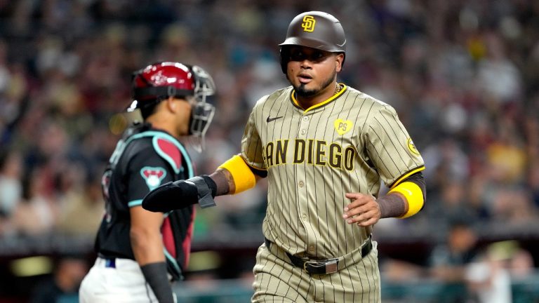 San Diego Padres' Luis Arraez scores on a base hit by Manny Machado during the first inning of a baseball game against the Arizona Diamondbacks, Saturday, May 4, 2024, in Phoenix. (Matt York/AP)