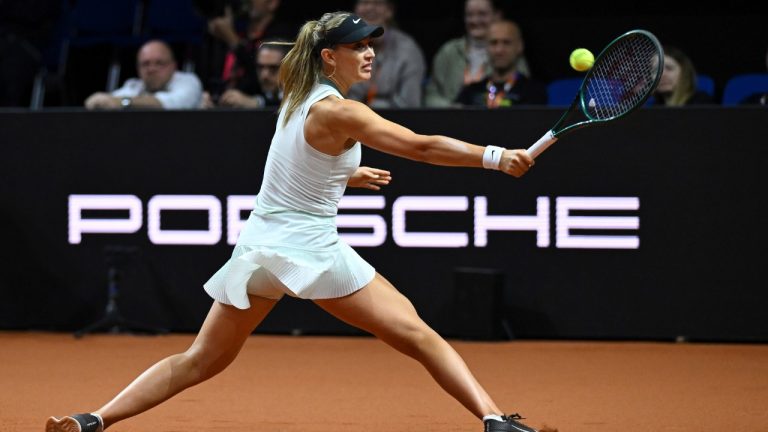 Spain's Paula Badosa hits a return to Aryna Sabalenka, of Belarus, during the first round match at the Porsche Tennis Grand Prix tournament, Wednesday, April 17, 2024, in Stuttgart, Germany. (Marijan Murat/dpa via AP)