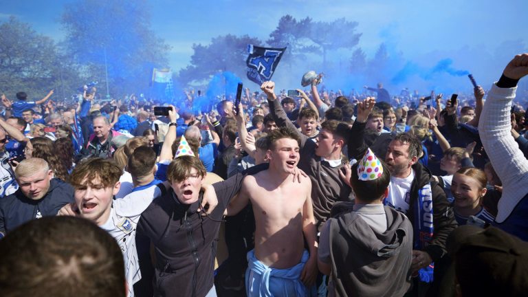 Ipswich Town fans react, ahead of the English Championship soccer match between Ipswich Town and Huddersfield Town at Portman Road, in Ipswich, Saturday, May 4, 2024. (Zac Goodwin/PA via AP)