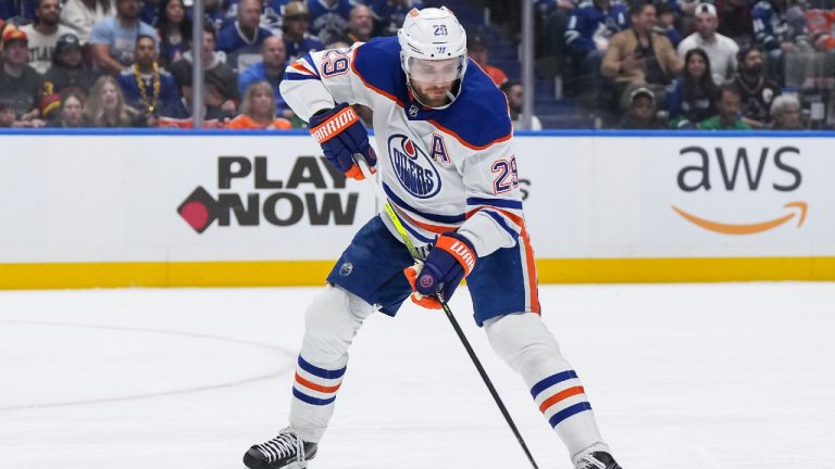 Edmonton Oilers' Leon Draisaitl passes the puck during the first period in Game 1 of an NHL hockey Stanley Cup second-round playoff series against the Vancouver Canucks, in Vancouver, on Wednesday, May 8, 2024. (Darryl Dyck/CP)