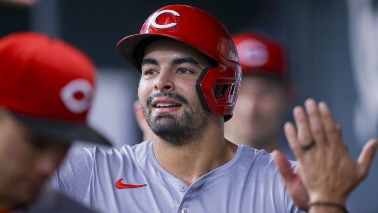 Cincinnati Reds' Christian Encarnacion-Strand celebrates with teammates in the dugout after scoring on a single by Jonathan India during the forth inning of a baseball game against the Texas Rangers in Arlington, Texas, Saturday, April 27, 2024. (Gareth Patterson/AP Photo)
