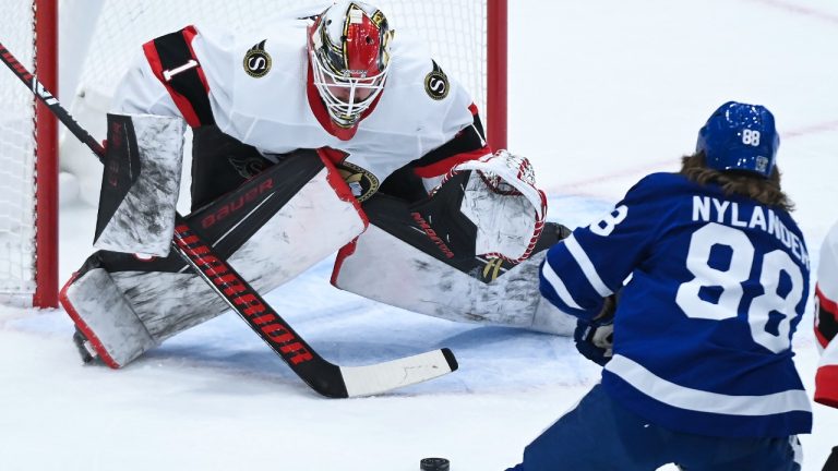 Ottawa Senators goaltender Marcus Hogberg (1) makes a save against Toronto Maple Leafs right wing William Nylander (88) during first period NHL hockey action in Toronto on Monday, February 15, 2021. (Nathan Denette/CP)