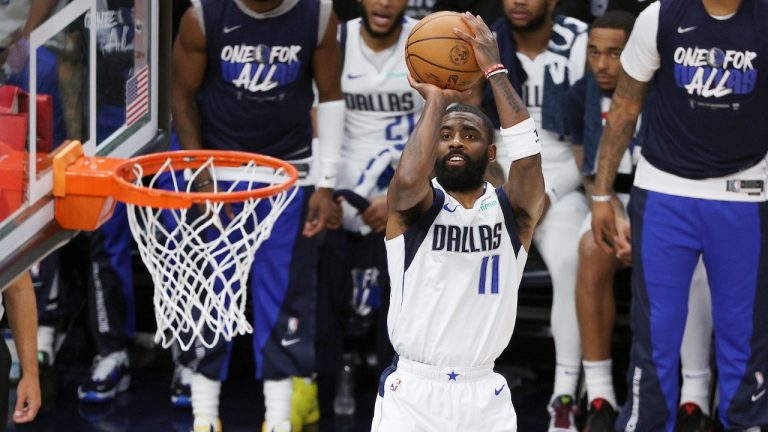 Dallas Mavericks guard Kyrie Irving gets off a shot against the Minnesota Timberwolves during the first half of Game 5 of the Western Conference finals in the NBA basketball playoffs, Thursday, May 30, 2024, in Minneapolis. (Matt Krohn/AP)