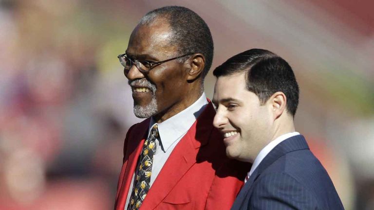 San Francisco 49ers Hall of Fame football player Jimmy Johnson, left, is honored by owner Jed York before an NFL game between the 49ers and St. Louis Rams. (Paul Sakuma/AP)