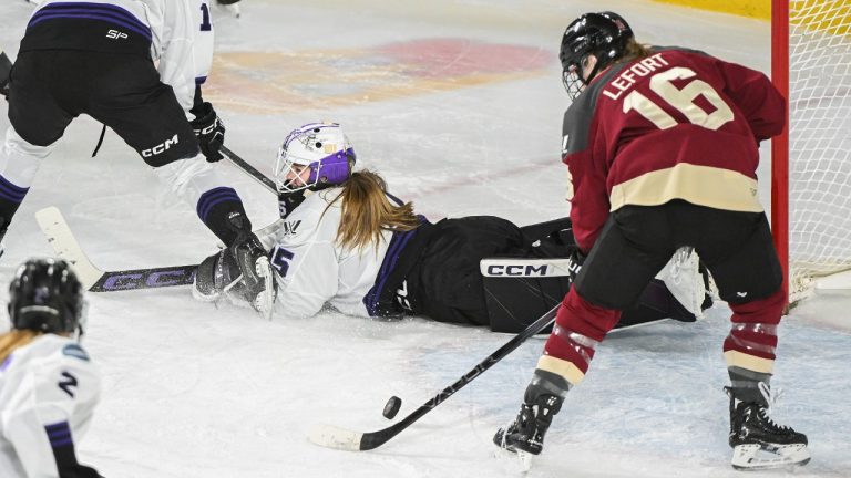 Montreal's Sarah Lefort (16) moves in to score on Minnesota goaltender Maddie Rooney during second period PWHL hockey action in Laval, Que., Sunday, Feb. 18, 2024. (Graham Hughes/CP)