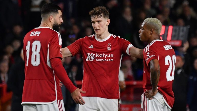 Nottingham Forest's Ryan Yates, center, speaks to team mates Felipe, left, and Danilo during the English FA Cup fifth round soccer match between Nottingham Forest and Manchester United at City ground in Nottingham, England, Wednesday, Feb. 28, 2024. (Rui Vieira/AP)
