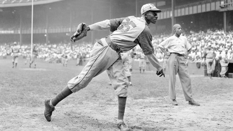 FILE - In this Aug. 2, 1942, file photo, Kansas City Monarchs pitcher Leroy Satchel Paige warms up at New York's Yankee Stadium before a Negro League game between the Monarchs and the New York Cuban Stars. (Matty Zimmerman/AP)