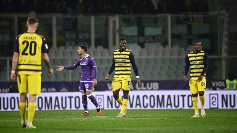 Parma's Ange-Yoan Bonny, center, celebrates scoring his side's second goal of the game during the Italian Cup soccer match between Fiorentina and Parma at Artemio Franchi Stadium in Florence, Italy, Wednesday, Dec. 6, 2023. (Massimo Paolone/LaPresse via AP)