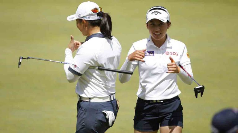 Atthaya Thitikul, of Thailand, right, and teammate Ruoning Yin, of China, react after Thitikul made a long putt on the 14th hole during the first round of the Dow Championship LPGA golf tournament, Thursday, June 27, 2024, at Midland Country Club in Midland, Mich. (Al Goldis/AP)