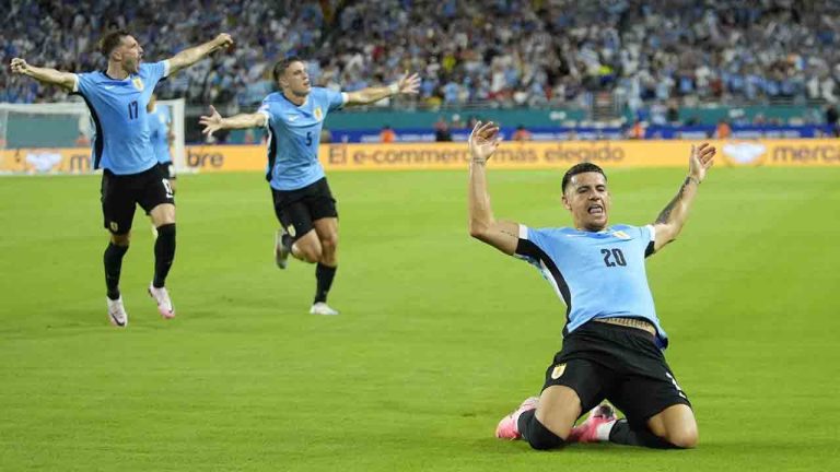 Uruguay's Maximiliano Araujo, right, celebrates after scoring his side's opening goal against Panama during a Copa America Group C soccer match in Miami Gardens, Fla, Sunday, June 23, 2024. (Rebecca Blackwell/AP)