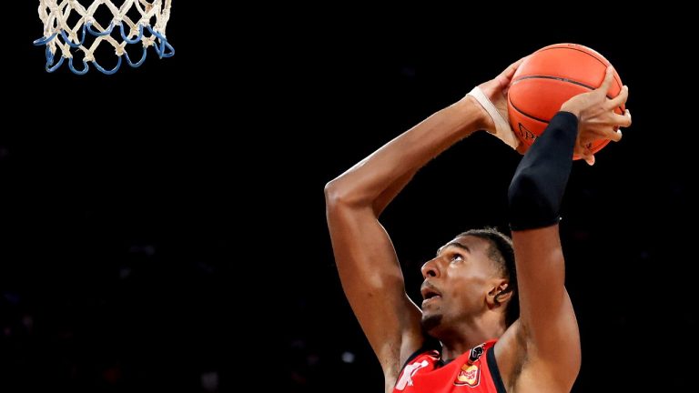 France's Alexandre Sarr of the Wildcats shoots during the team's game against the Cairns Taipans in Perth, Australia, Saturday, Feb. 10, 2024. This year's NBA draft may be one of the weakest in years, with no clear-cut choice at No. 1 and an overall lack of depth. What it will likely have again this year: a French connection at the top. A year after San Antonio selected Victor Wembanyama with the No. 1 pick, fellow Frenchmen Sarr and Zaccharie Risacher could go 1-2 in the June 26 draft. (Richard Wainwright/AAP Image via AP)