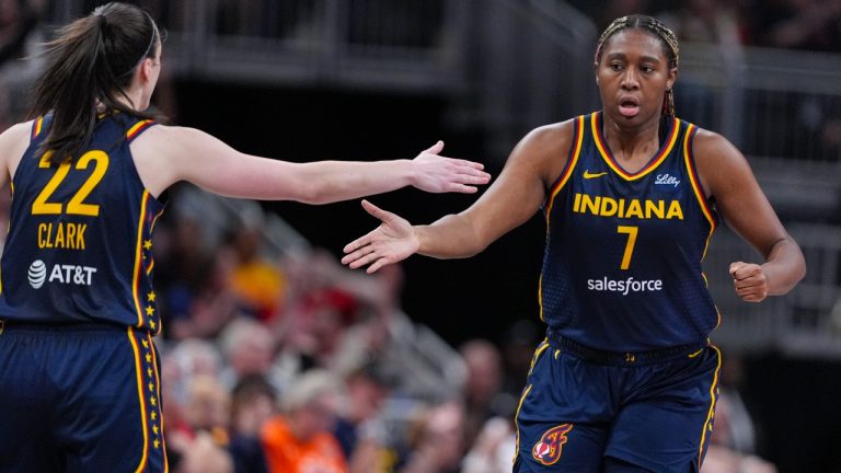 Indiana Fever guard Caitlin Clark (22) celebrates with forward Aliyah Boston (7) in the second half of a WNBA basketball game against the Los Angeles Sparks in Indianapolis, Tuesday, May 28, 2024. (Michael Conroy/AP)