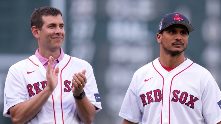 Boston Celtics general manager Brad Stevens, left, stands with head coach Joe Mazzulla being honoured for their championship prior to an MLB game between the Boston Red Sox and the Toronto Blue Jays, June 24, 2024, in Boston. (AP Photo/Charles Krupa)