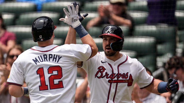 Ramón Laureano celebrates with Sean Murphy in the fifth inning of a baseball game against the Detroit Tigers. (Mike Stewart/AP)