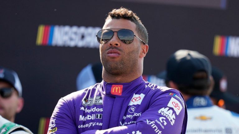 Bubba Wallace looks on before driver introductions at a NASCAR Cup Series, June 16, 2024, at Iowa Speedway in Newton, Iowa. (AP Photo/Charlie Neibergall)