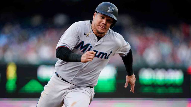 Miami Marlins' Avisail Garcia rounds third on the way to scoring on a hit by Brian Anderson during the sixth inning of the team's baseball game against the Washington Nationals at Nationals Park, Friday, July 1, 2022, in Washington. (Alex Brandon/AP)