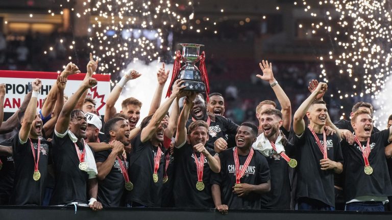 Vancouver Whitecaps hoist the Voyageurs Cup following the Canadian Championship soccer final CP/Darryl Dyck