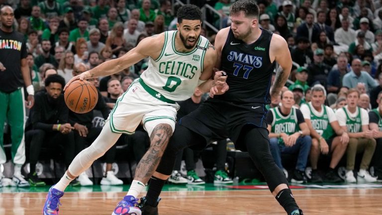 Boston Celtics forward Jayson Tatum (0) drives toward the basket as Dallas Mavericks guard Luka Doncic (77) defends during the first half of Game 1 of basketball's NBA Finals on Thursday, June 6, 2024, in Boston. (Charles Krupa/AP)