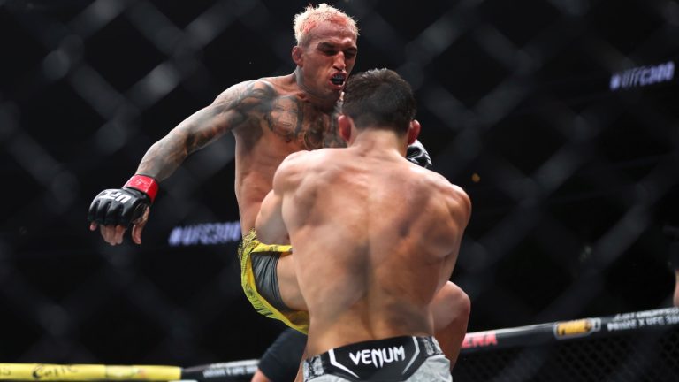 Charles Oliveira jump-kicks Arman Tsarukyan during a UFC 300 mixed martial arts lightweight bout in Las Vegas. (Ellen Schmidt/Las Vegas Review-Journal via AP)