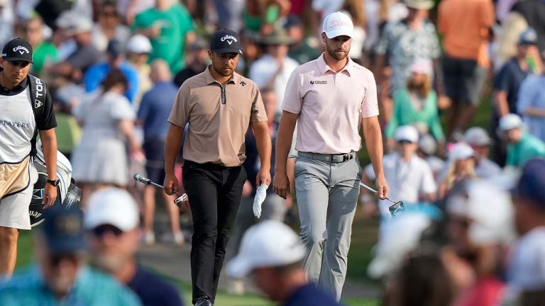 Xander Schauffele, left, and Wyndham Clark walk to the 17th green during the final round of The Players Championship golf tournament Sunday, March 17, 2024, in Ponte Vedra Beach, Fla. (Lynne Sladky/AP)