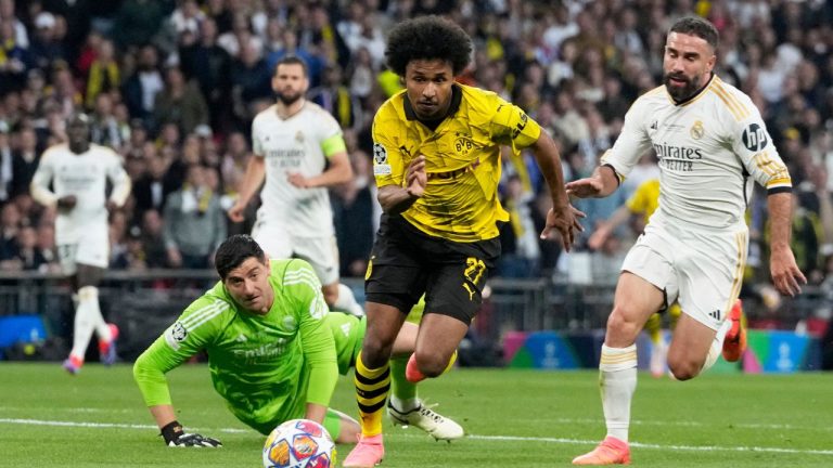 Dortmund's Karim Adeyemi gets past Real Madrid's goalkeeper Thibaut Courtois during the Champions League final soccer match between Borussia Dortmund and Real Madrid at Wembley stadium in London, Sunday, June 2, 2024. (Frank Augstein/AP)