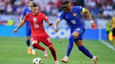 Kylian Mbappe scores in return to lineup as France draws even with Poland