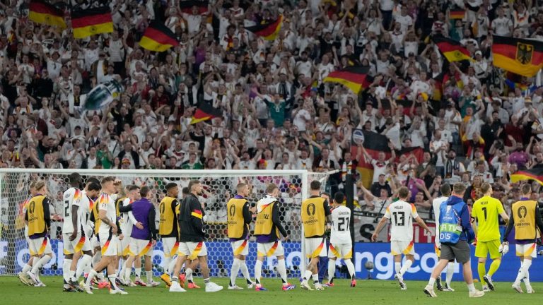 German players celebrate in front of their fans after a match against Scotland at the Euro 2024 tournament. June 14, 2024. (AP Photo/Matthias Schrader)