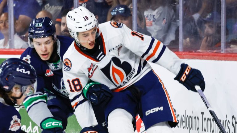 Seattle Thunderbirds' Nico Myatovic checks Kamloops Blazers' Harrison Brunicke during Memorial Cup action, May 31, 2023. (The Canadian Press/Jeff McIntosh)