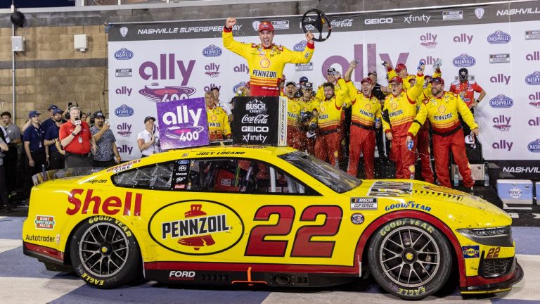 Joey Logano , top,celebrates after winning a NASCAR Cup Series auto race, Sunday, June 30, 2024, in Gladeville, Tenn. (AP Photo/Wade Payne)