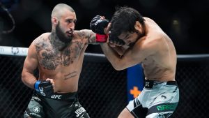Canada's Charles Jourdain, left, punches Brazil's Kron Gracie. (Frank Franklin II/AP Photo)
