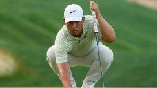 Tom Kim clings to a one-shot lead over Scheffler, Bhatia in rain-delayed Travelers