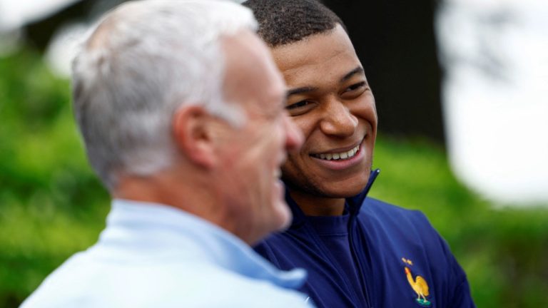 French soccer player Kylian Mbappe, right, talks to head coach Didier Deschamps at the national soccer team training center in Clairefontaine, west of Paris, Monday, June 3, 2024 ahead of the UEFA Euro 2024. (Sarah Meyssonnier/Pool photo via AP)
