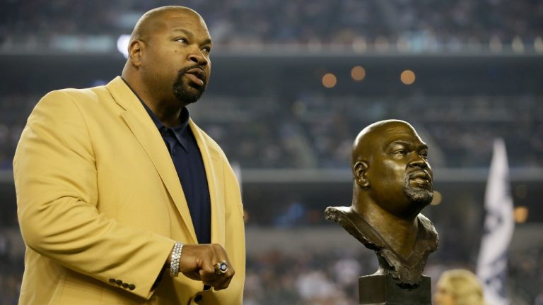 FILE - Dallas Cowboys Hall of Fame Inductee Larry Allen shows off his Hall of Fame ring at halftime of an NFL football game. (AP Photo/Tim Sharp, File)