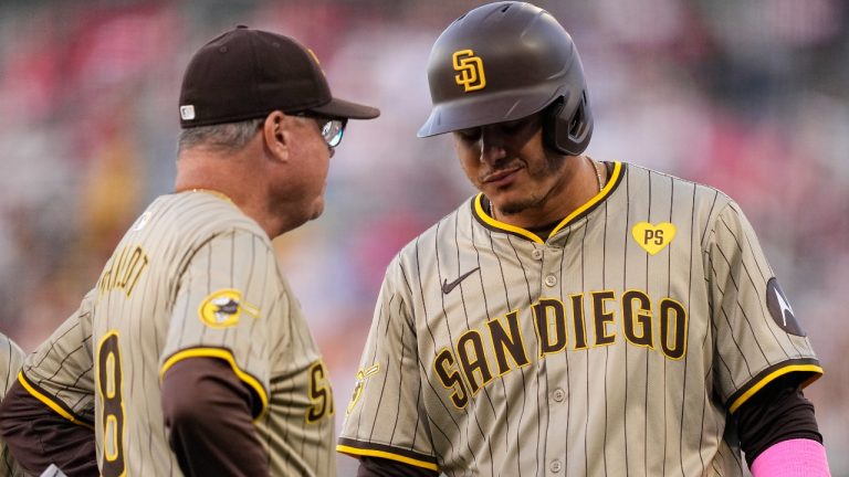 San Diego Padres' Manny Machado, right, talks with manager Mike Shildt before being taken out of the game with an injury during the fourth inning of a baseball game against the Los Angeles Angels Wednesday, June 5, 2024, in Anaheim, Calif. (Mark J. Terrill/AP)