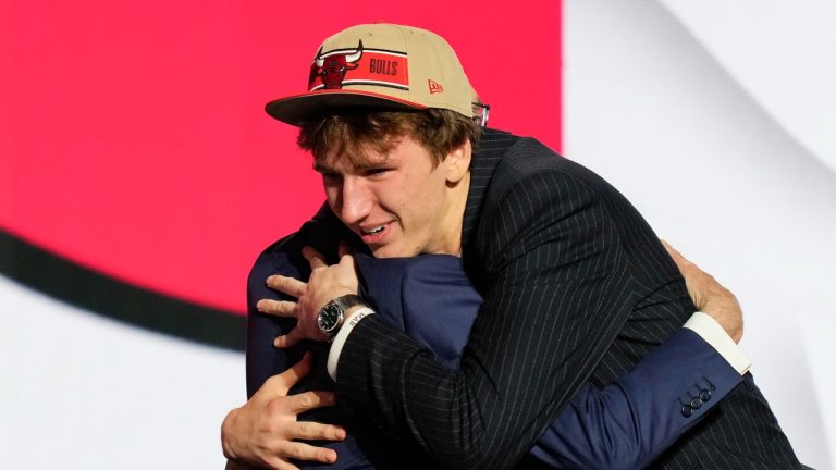 Matas Buzelis hugs NBA commissioner Adam Silver after being selected by the Chicago Bulls as the 11th overall pick during the NBA draft, June 26, 2024. (AP Photo/Julia Nikhinson)