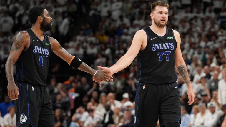 Dallas Mavericks guard Kyrie Irving (11) and Dallas Mavericks guard Luka Doncic (77) during the first half of Game 2 of the NBA basketball Western Conference finals, Friday, May 24, 2024, in Minneapolis. (Abbie Parr/AP)