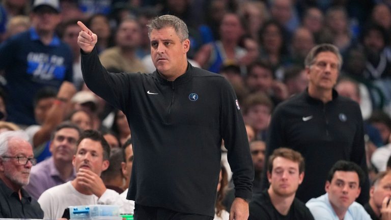Micah Nori, the lead assistant coach of the Minnesota Timberwolves, directs play during the first half in Game 3 of the NBA basketball Western Conference finals against the Dallas Mavericks, Sunday, May 26, 2024, in Dallas. (AP/Julio Cortez)